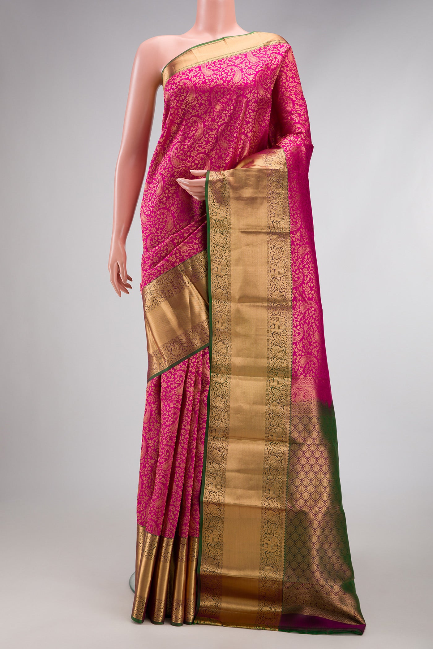 Dark Pink Kanchipuram Silk Saree with Zari Brocade on the body and Zari Border.  displayed on a mannequin