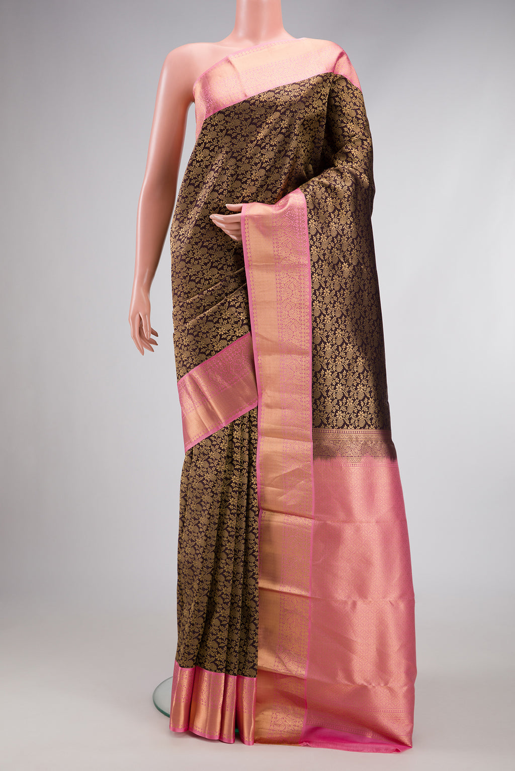 Coffee Brown Kanjivaram Silk Saree with Zari Brocade on the body and Zari Border.  displayed on a mannequin