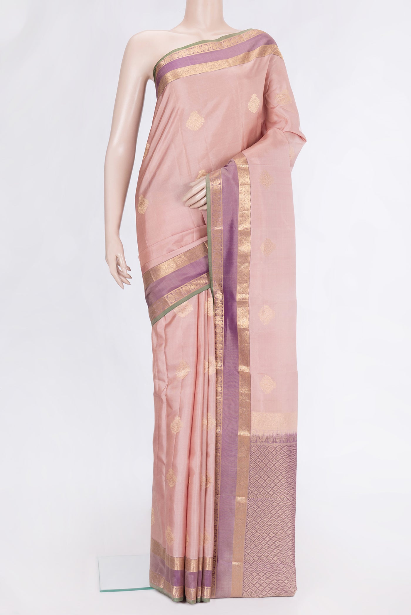 Rose Gold Dual Tone Kanchipuram Silk Saree with Zari Butta on the body and Zari Border.  displayed on a mannequin