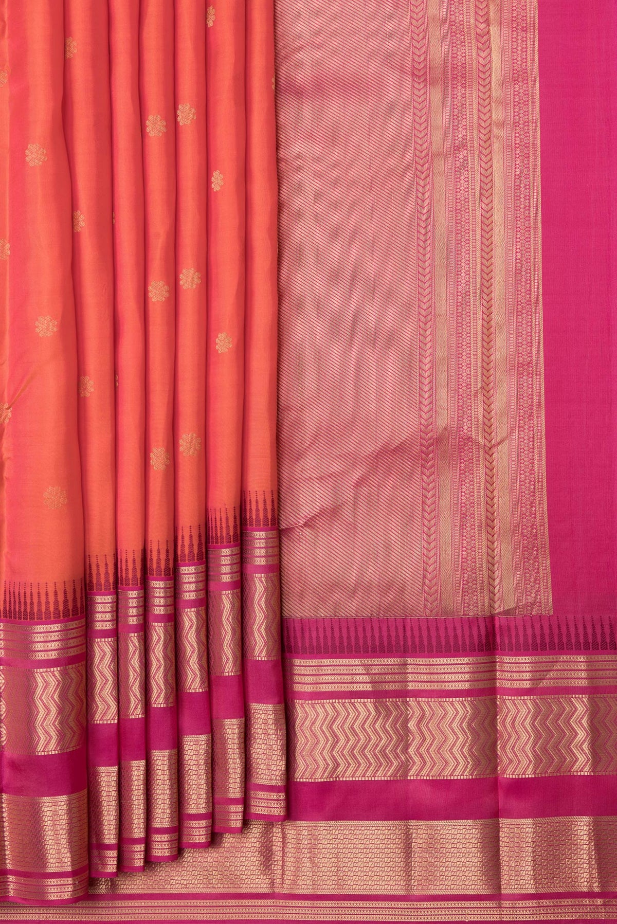 Pleats and pallu of Orange Dual Tone Kanjivaram Silk Saree with Zari Butta on the body and Zari Border. 