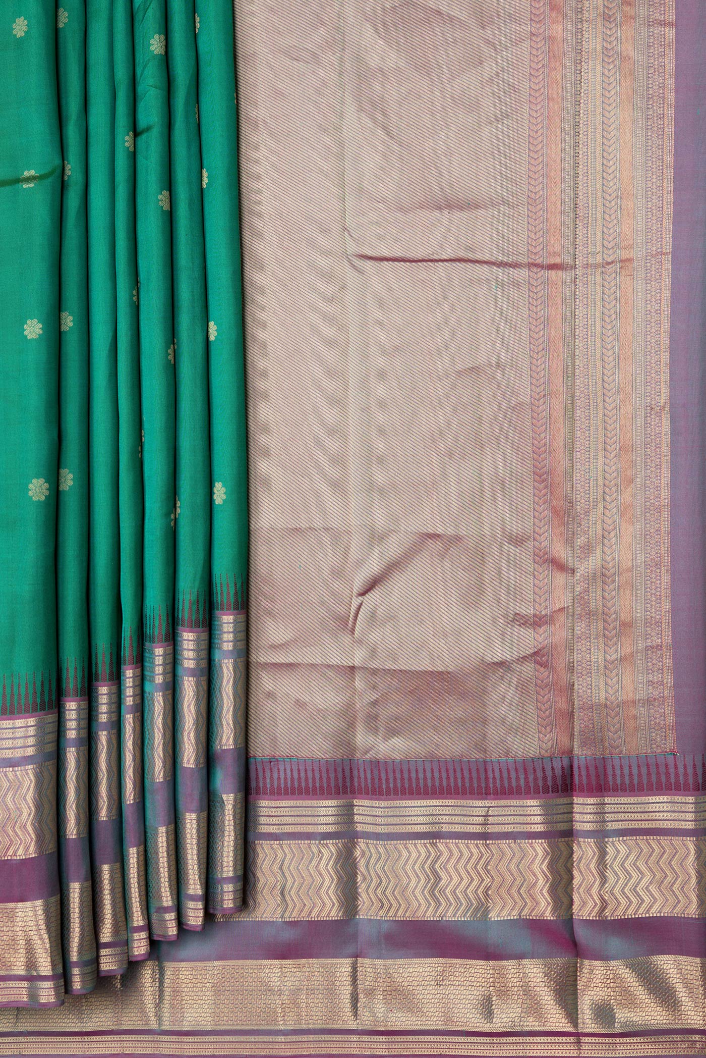 Pleats and pallu of Green Dual Tone Kanjivaram Silk Saree with Zari Butta on the body and Zari Border. 