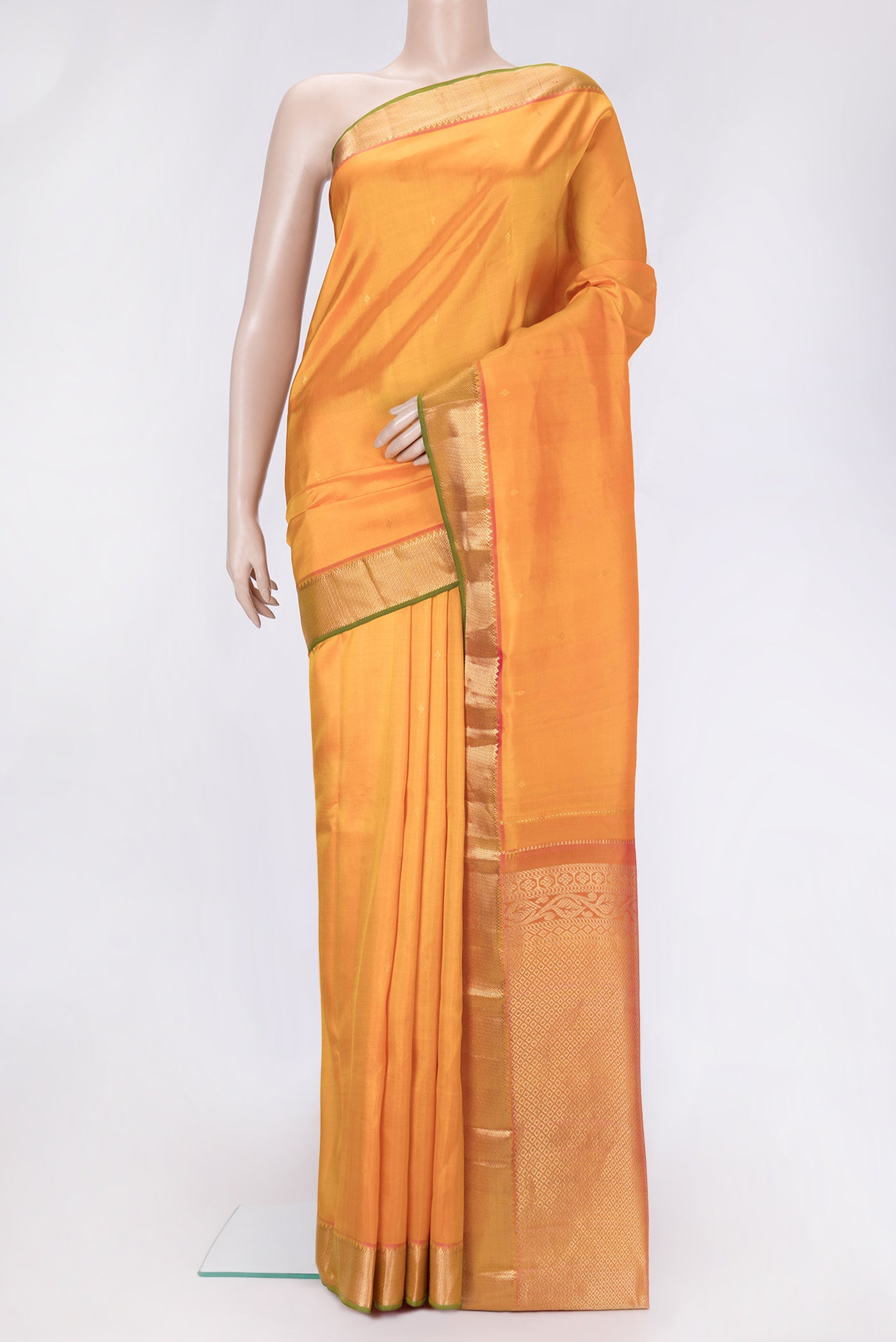 Orange Dual Tone Kanjivaram Silk Saree with Zari Butta on the body and Zari Border.  displayed on a mannequin