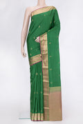 Green Dual Tone Kanchipuram Silk Saree with Zari Butta on the body and Zari Border.  displayed on a mannequin