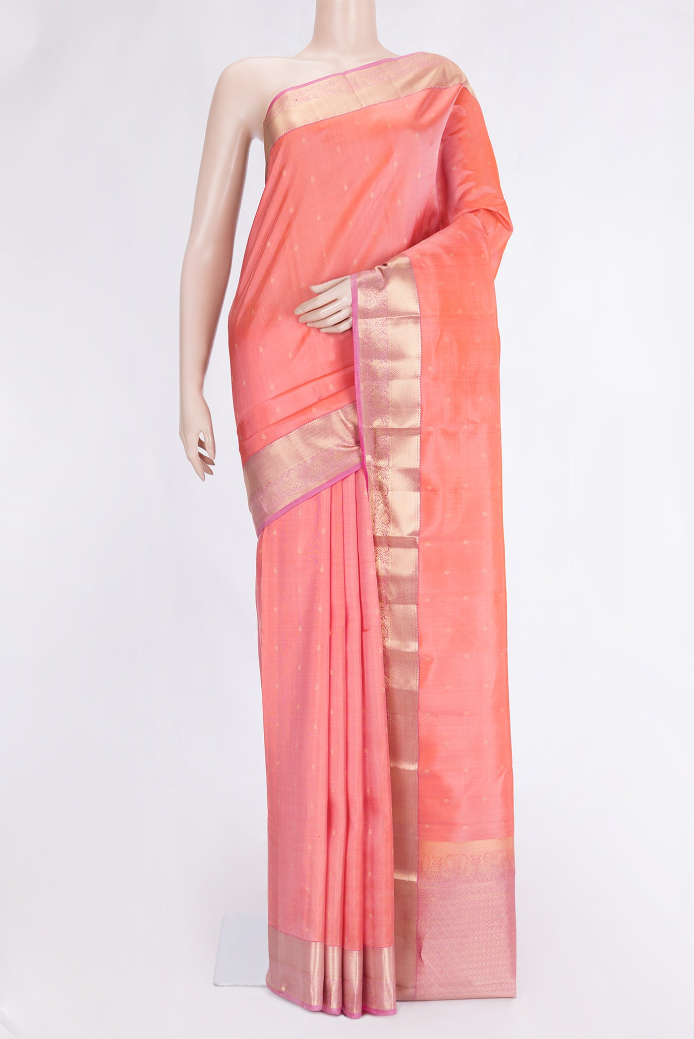 Peach Dual Tone Kanchipuram Silk Saree with Zari Butta on the body and Zari Border.  displayed on a mannequin