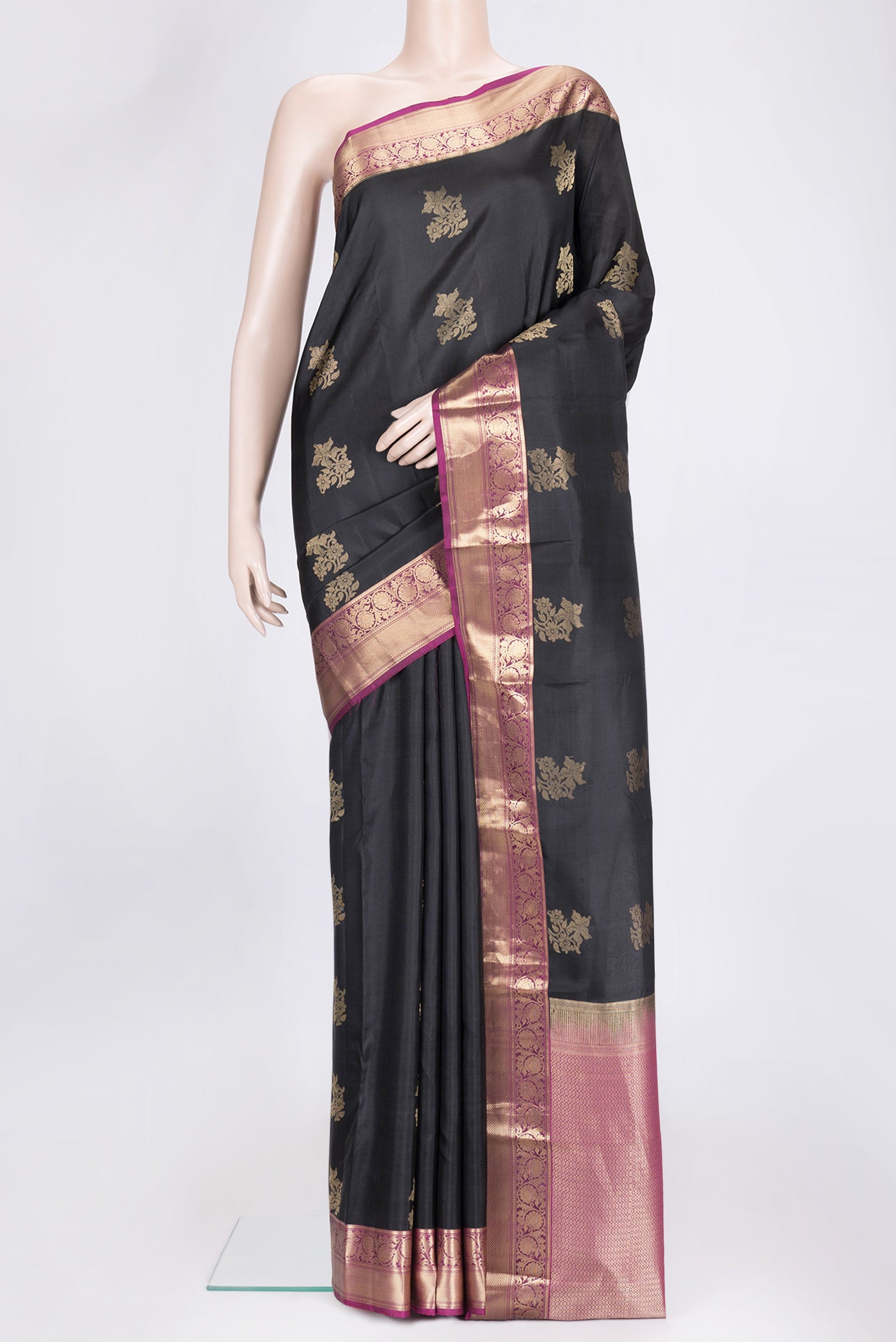 Black Dual Tone Kanchipuram Silk Saree with Zari Butta on the body and Zari Border.  displayed on a mannequin