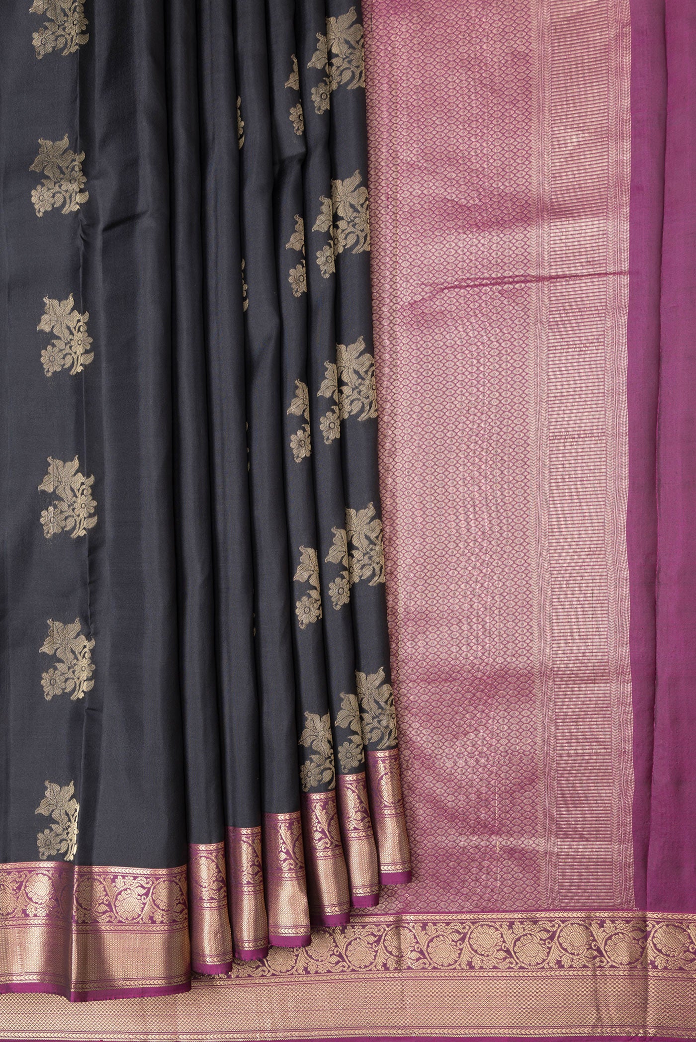 Pleats and pallu of Black Dual Tone Kanchipuram Silk Saree with Zari Butta on the body and Zari Border. 