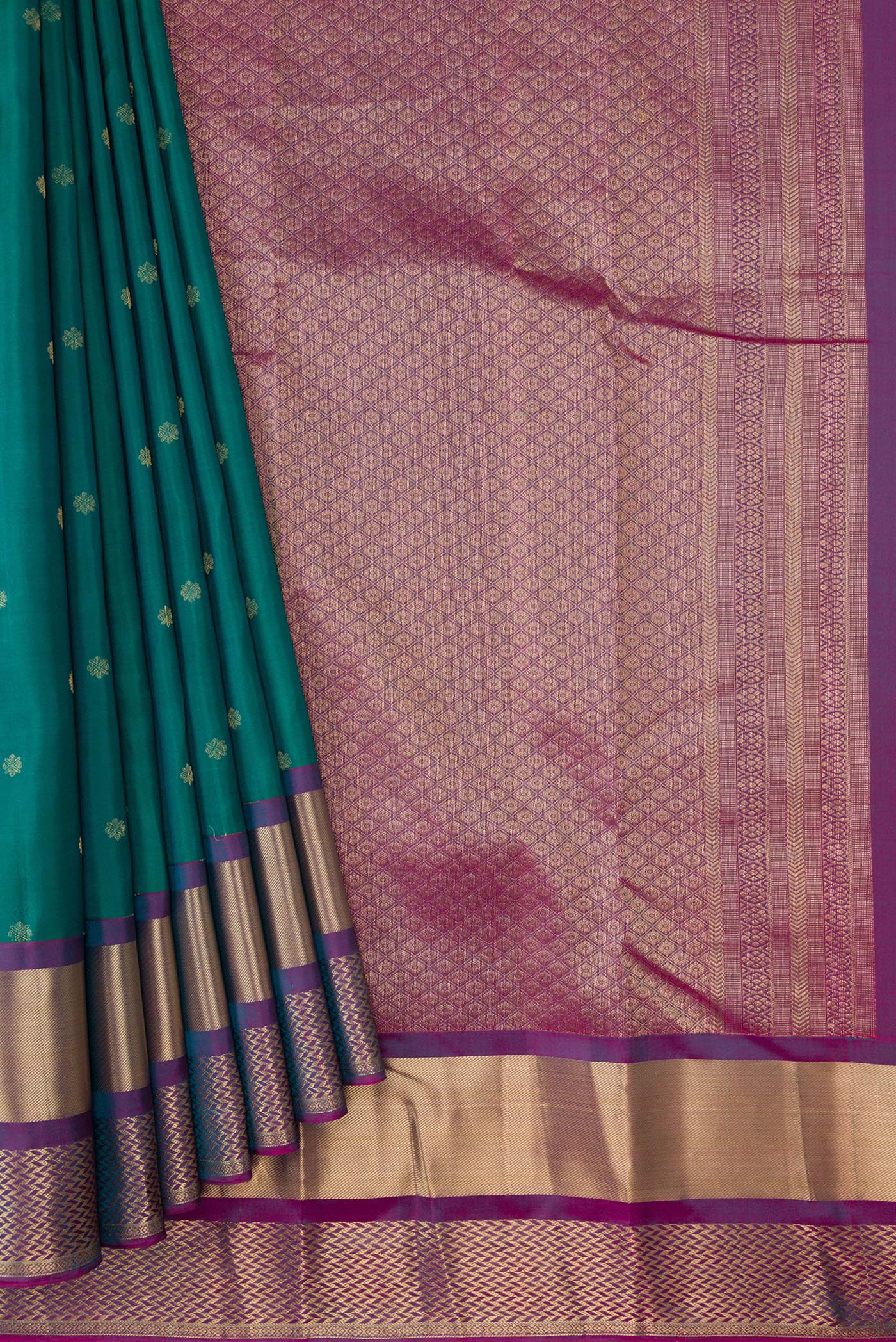 Pleats and pallu of Green Dual Tone Kanchipuram Silk Saree with Zari Butta on the body and Zari Border. 