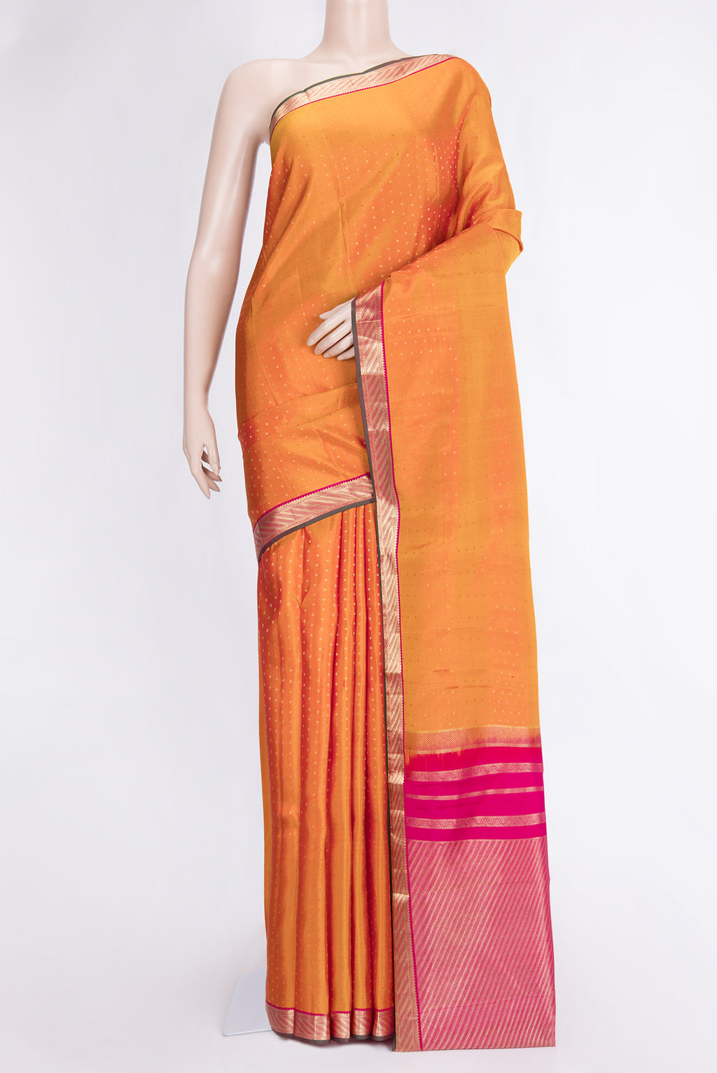 Mustard Dual Tone Kanchipuram Silk Saree with Zari Butta on the body and Zari Border.  displayed on a mannequin