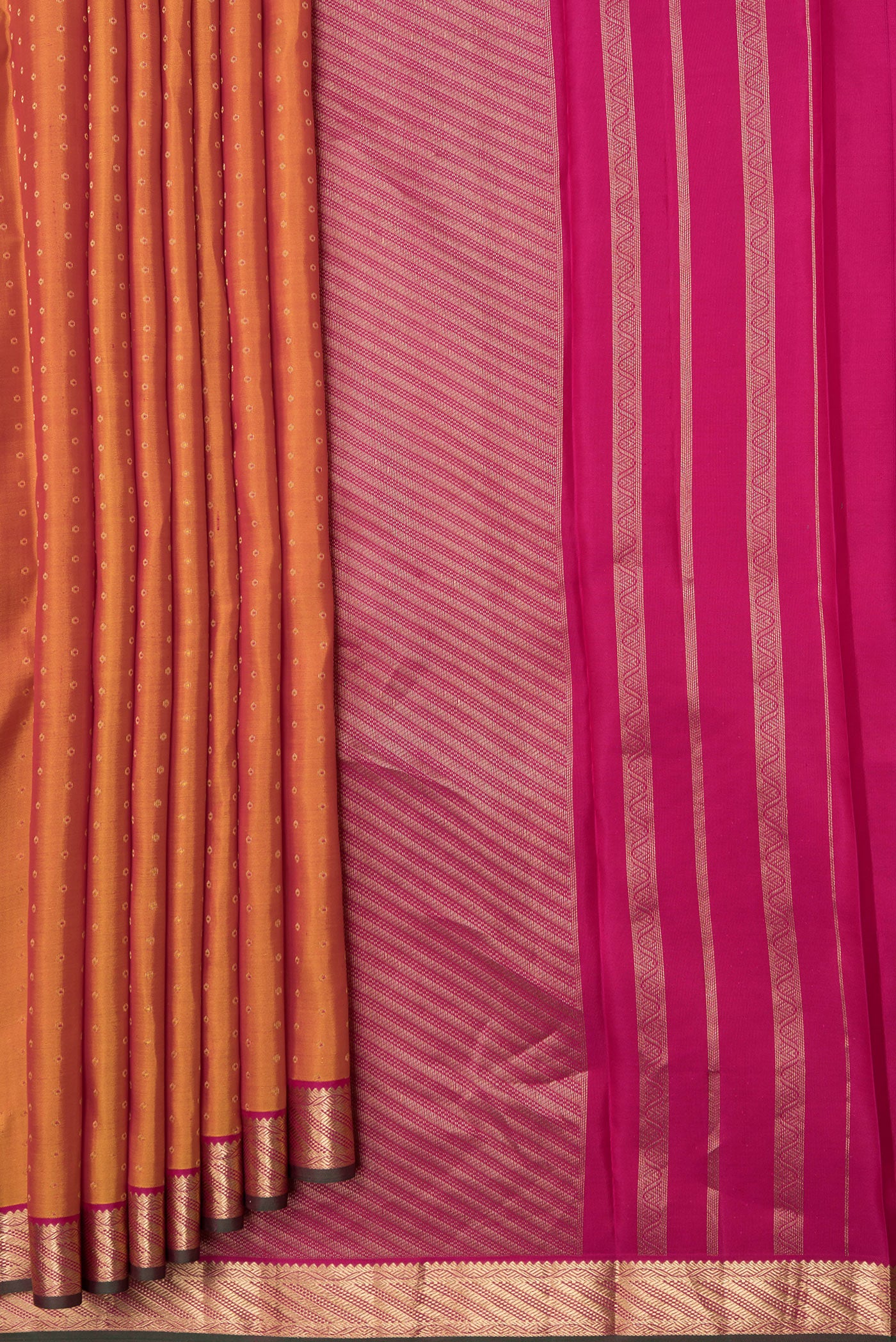 Pleats and pallu of Mustard Dual Tone Kanchipuram Silk Saree with Zari Butta on the body and Zari Border. 