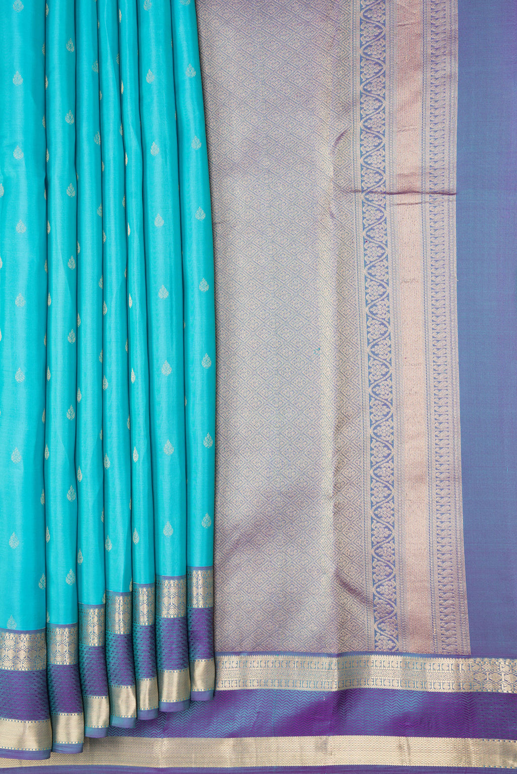 Pleats and pallu of Sky Blue Dual Tone Kanchipuram Silk Saree with Zari Butta on the body and Zari And Thread Border. 