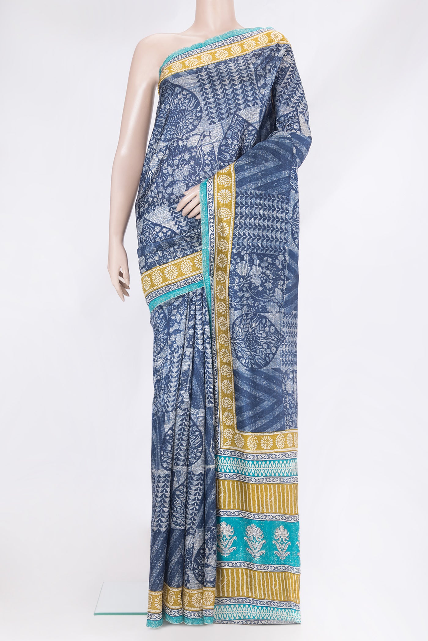 Navy Blue Tussar Silk Saree with Printed design on the body and Printed Border.  displayed on a mannequin