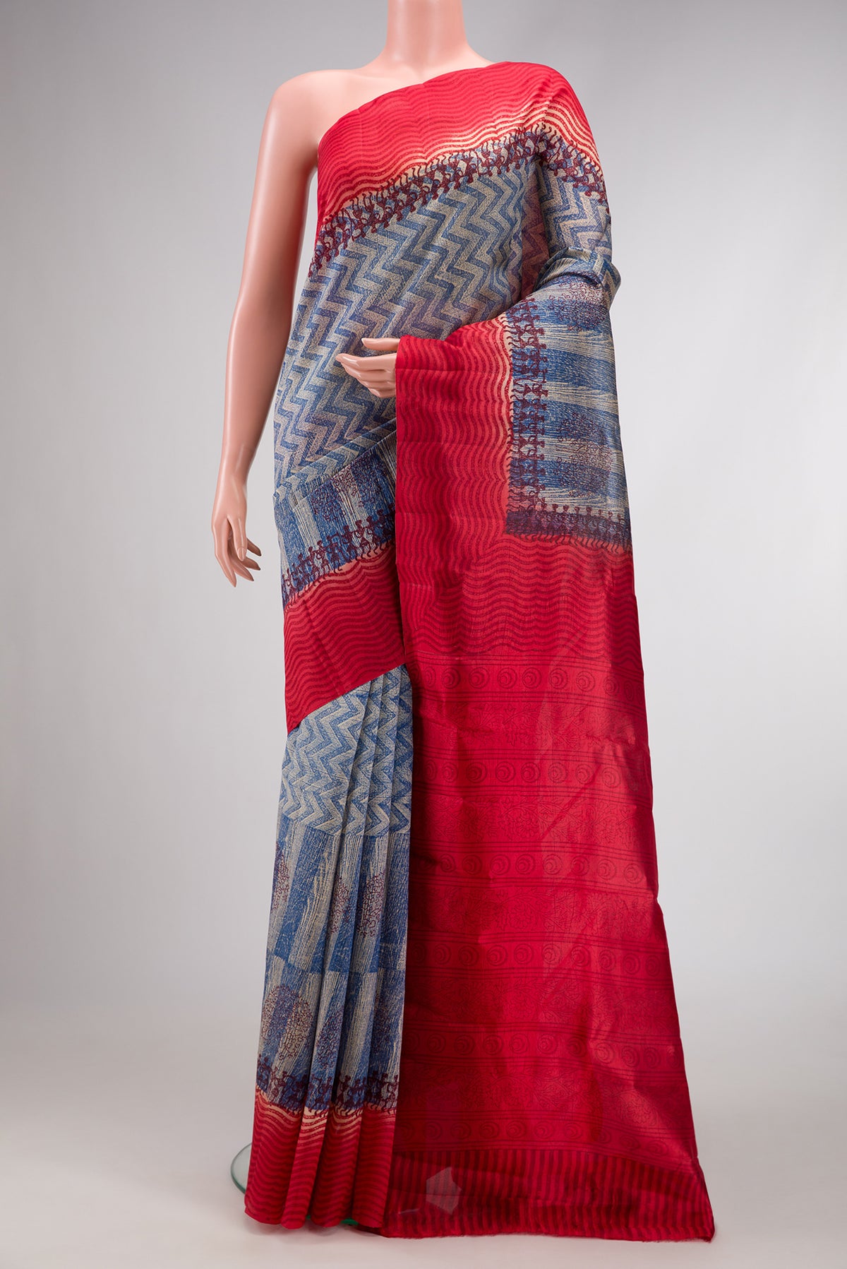 Peacock Blue Dual Tone Tussar Silk Saree with Printed design on the body and Printed Border.  displayed on a mannequin