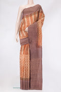 Brick Orange Tussar Silk Saree with Printed design on the body and Printed Border.  displayed on a mannequin