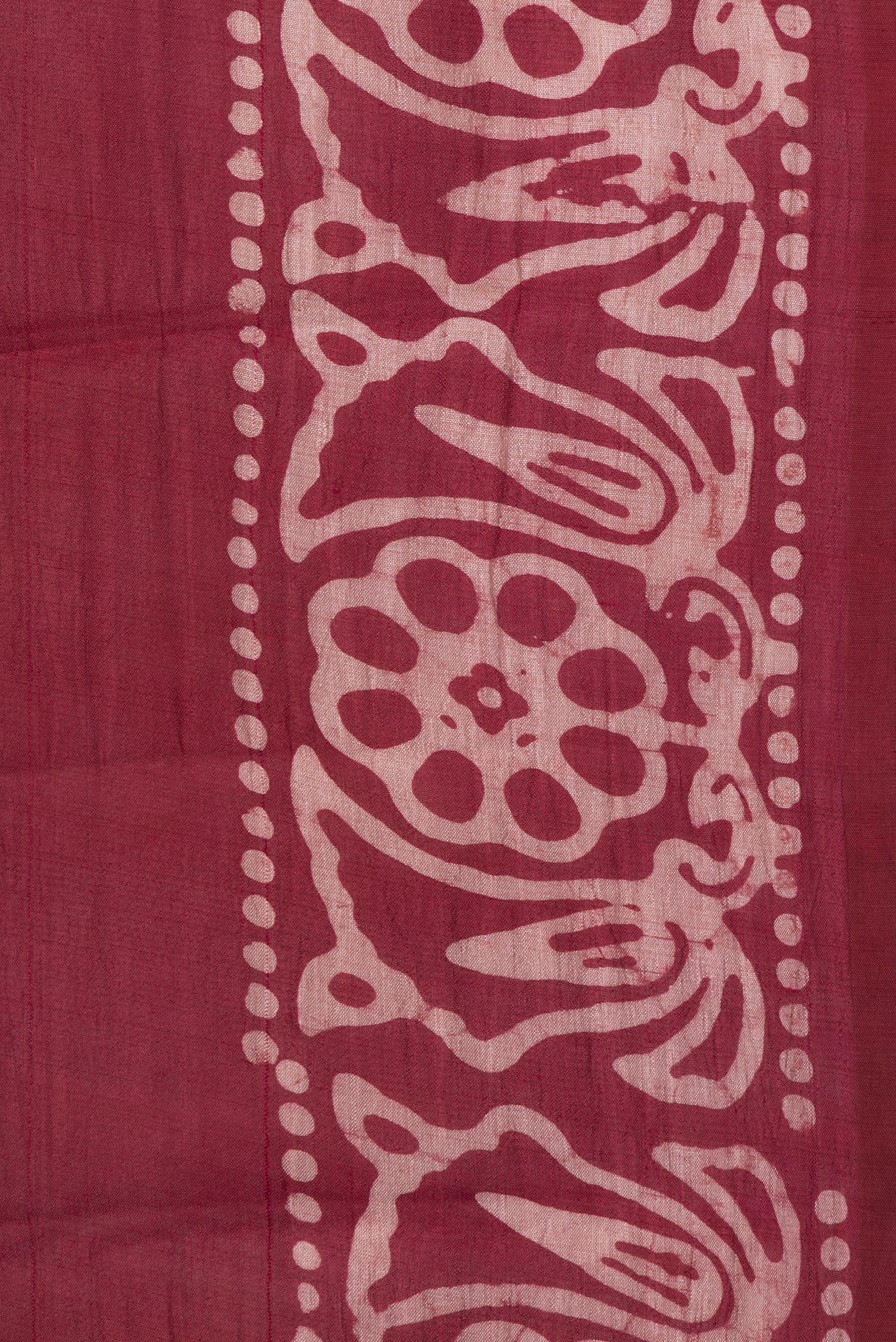 Border image of Maroon Dual Tone Tussar Silk Saree with Batik Print on the body and Printed Border. 