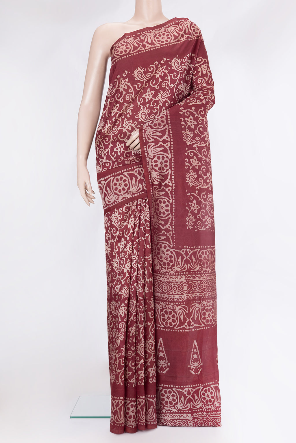 Maroon Dual Tone Tussar Silk Saree with Batik Print on the body and Printed Border.  displayed on a mannequin