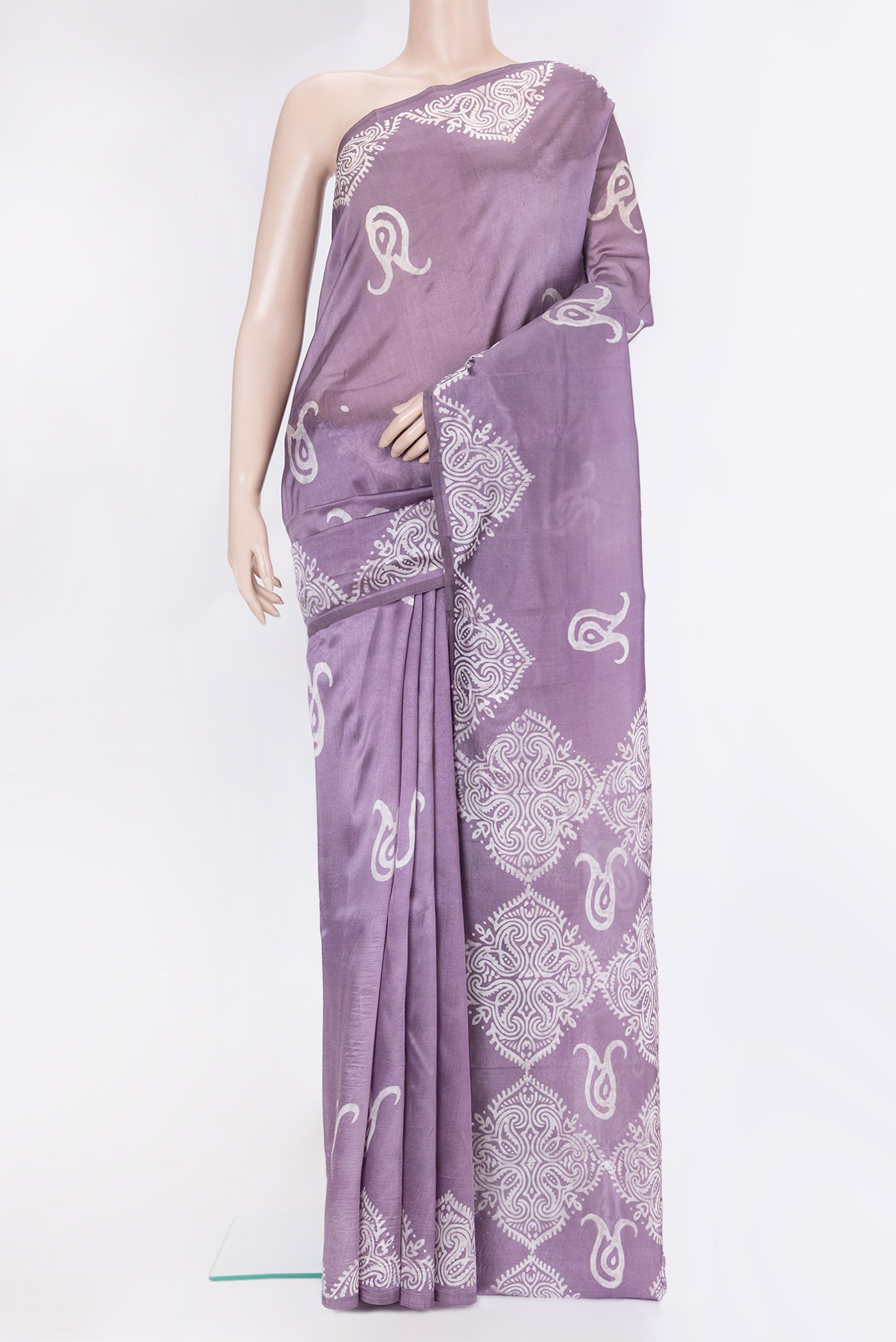 Lavender Dual Tone Tussar Silk Saree with Batik Print on the body and Printed Border.  displayed on a mannequin