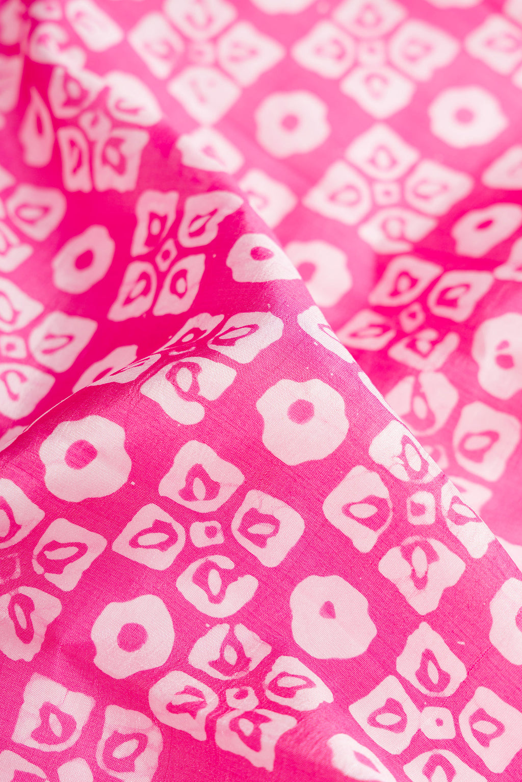 Close up of Pink Dual Tone Tussar Silk Saree with Printed design on the body and Printed Border.  displaying folds