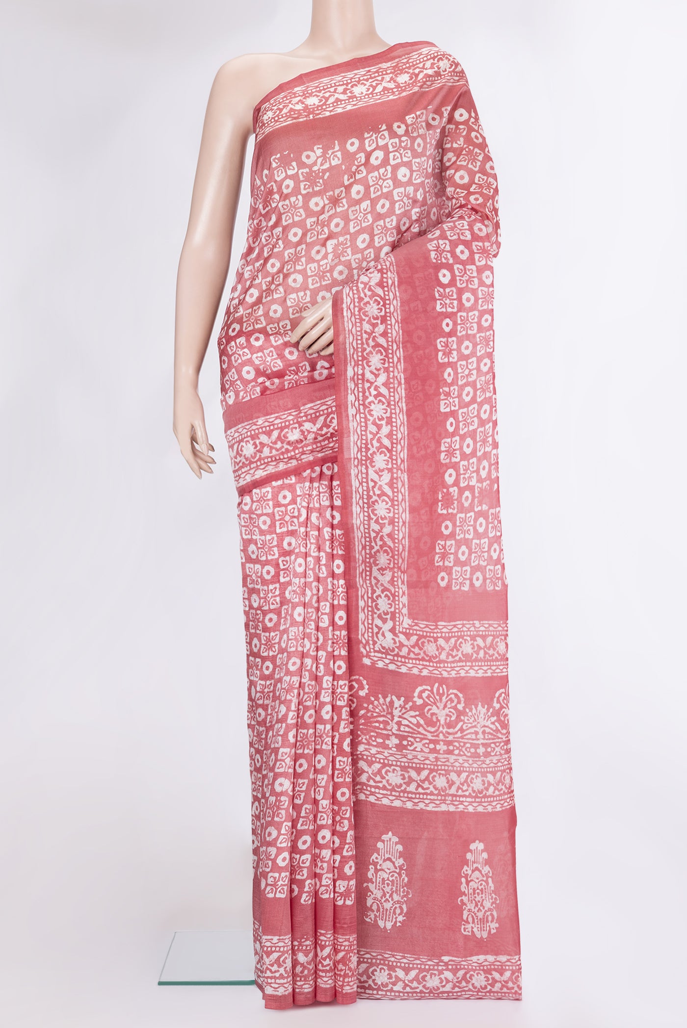 Peach Dual Tone Tussar Silk Saree with Batik Print on the body and Printed Border.  displayed on a mannequin