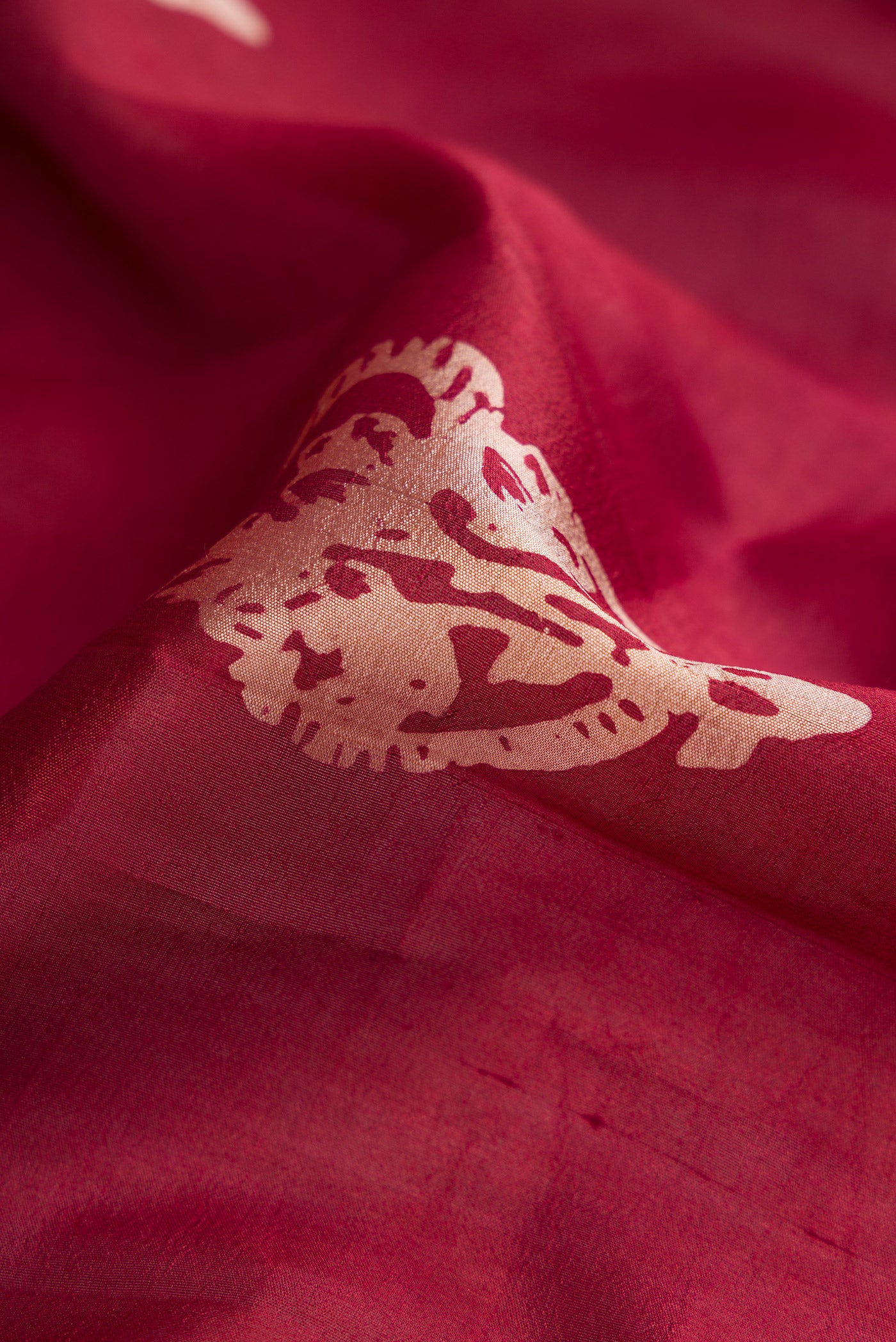 Close up of Coffee Brown Dual Tone Tussar Silk Saree with Printed design on the body and Fancy Border.  displaying folds