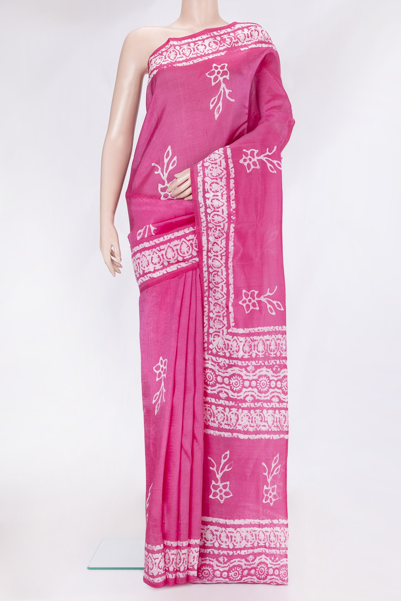Rose pink Dual Tone Tussar Silk Saree with Batik Print on the body and Printed Border.  displayed on a mannequin