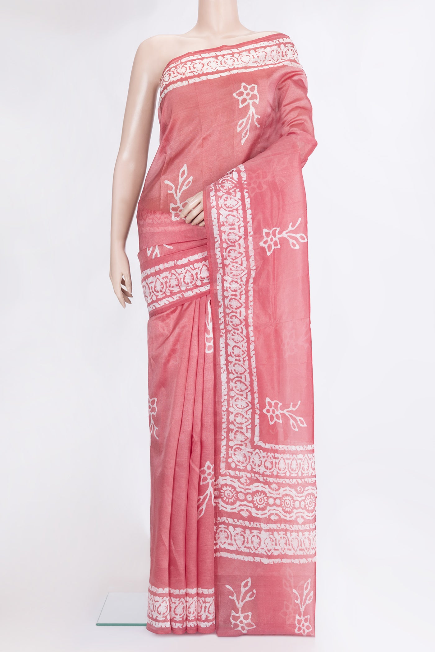 Pink Tussar Silk Saree with Printed design on the body and Printed Border.  displayed on a mannequin