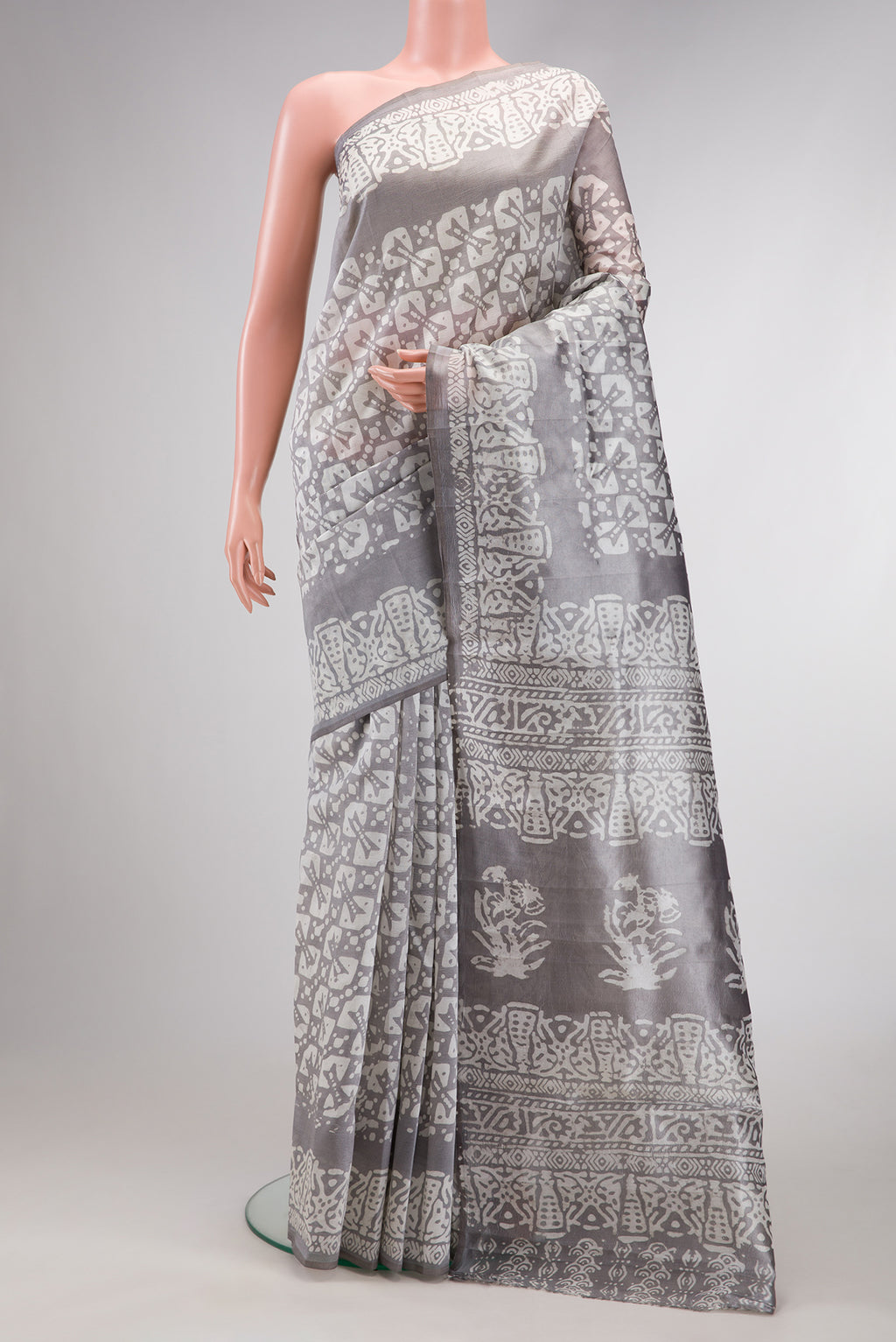 Grey Dual Tone Tussar Silk Saree with Printed design on the body and Printed Border.  displayed on a mannequin