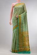 Beige Dual Tone Tussar Silk Saree with Printed design on the body and Printed Border.  displayed on a mannequin