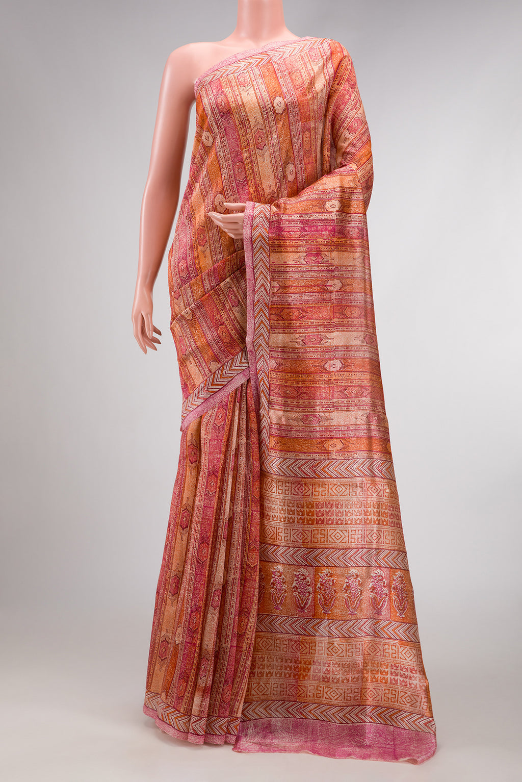 Coral Dual Tone Tussar Silk Saree with Printed design on the body and Printed Border.  displayed on a mannequin