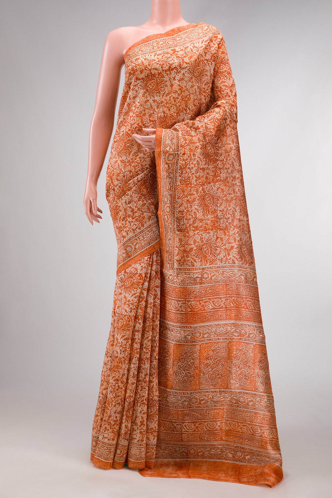 Orange Dual Tone Tussar Silk Saree with Printed design on the body and Printed Border.  displayed on a mannequin