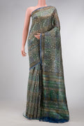 Grey Dual Tone Tussar Silk Saree with Printed design on the body and Printed Border.  displayed on a mannequin