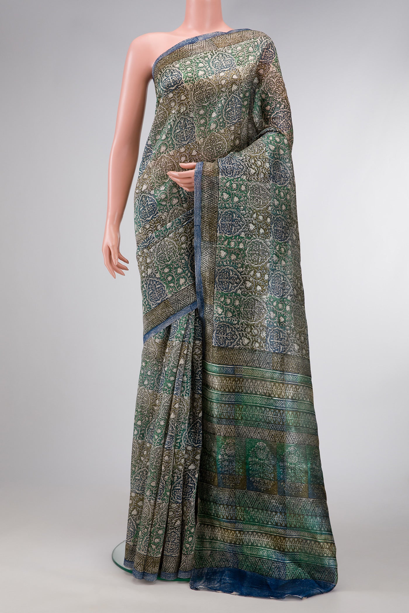 Grey Dual Tone Tussar Silk Saree with Printed design on the body and Printed Border.  displayed on a mannequin