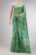 Pista Green Dual Tone Tussar Silk Saree with Printed design on the body and Printed Border.  displayed on a mannequin