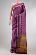 Burgundy Dual Tone Kanchipuram Silk Saree with Jacquard design on the body and Temple Border.  displayed on a mannequin