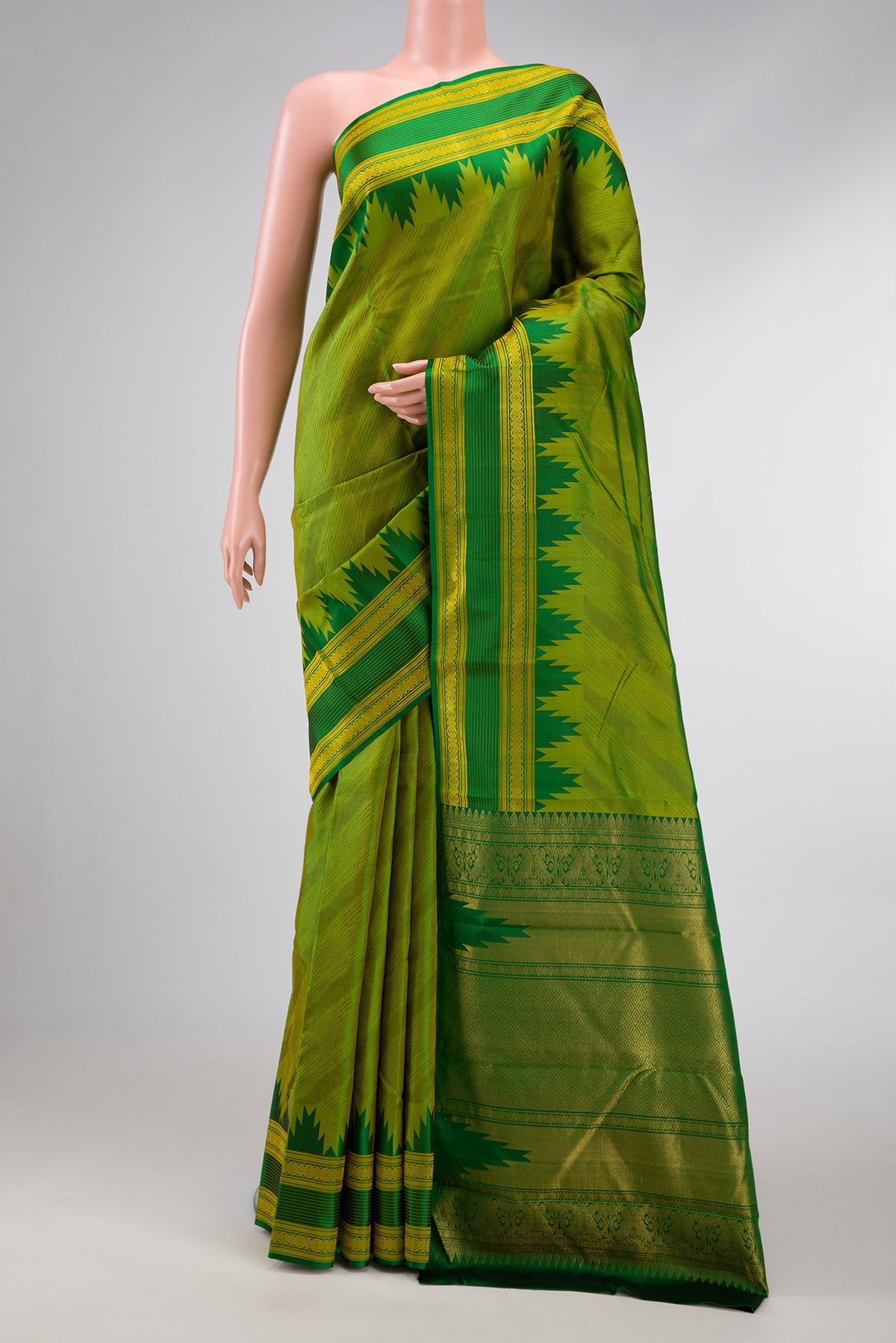 Pista Green Dual Tone Kanchipuram Silk Saree with Jacquard design on the body and Temple Border.  displayed on a mannequin