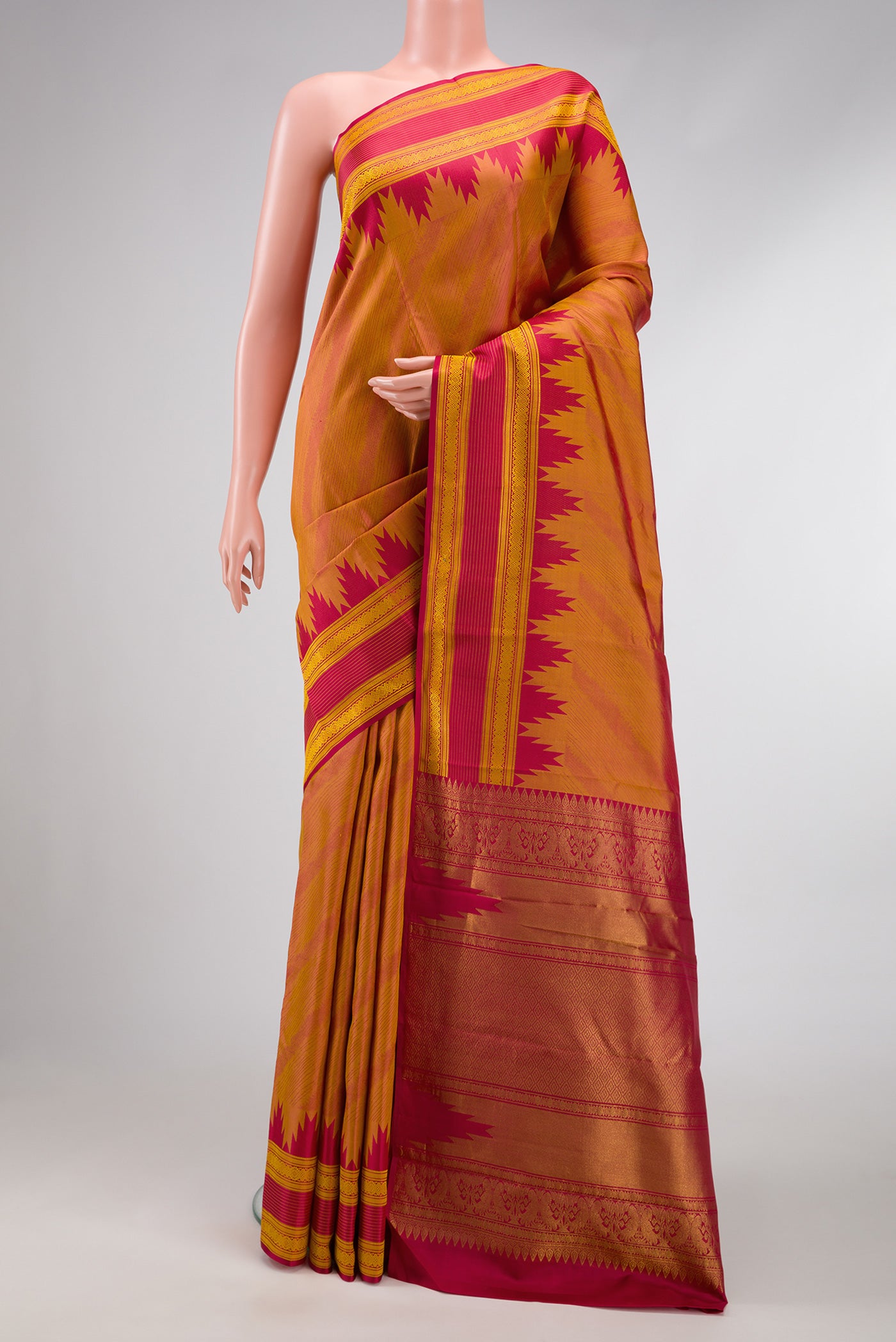 Mustard Dual Tone Kanchipuram Silk Saree with Jacquard design on the body and Temple Border.  displayed on a mannequin