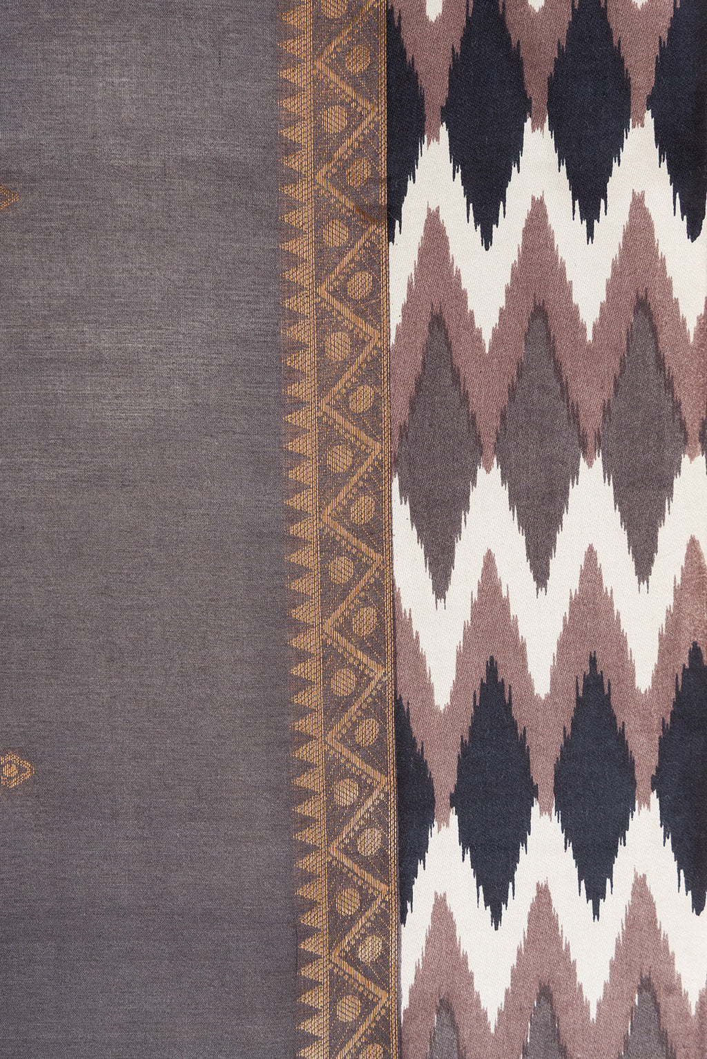 Border image of Grey Dual Tone Tussar Silk Saree with Zari Butta on the body and Ikat Border. 