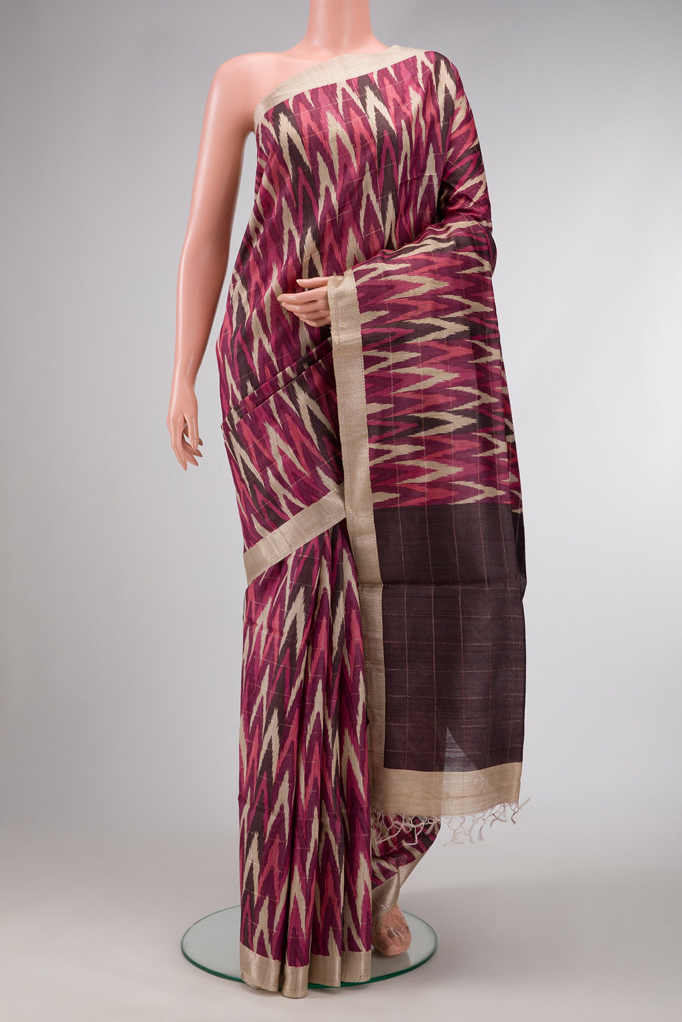 Pink and Off White Color Tussar Silk Saree with Ikat Print on the body and Zari Border.  displayed on a mannequin
