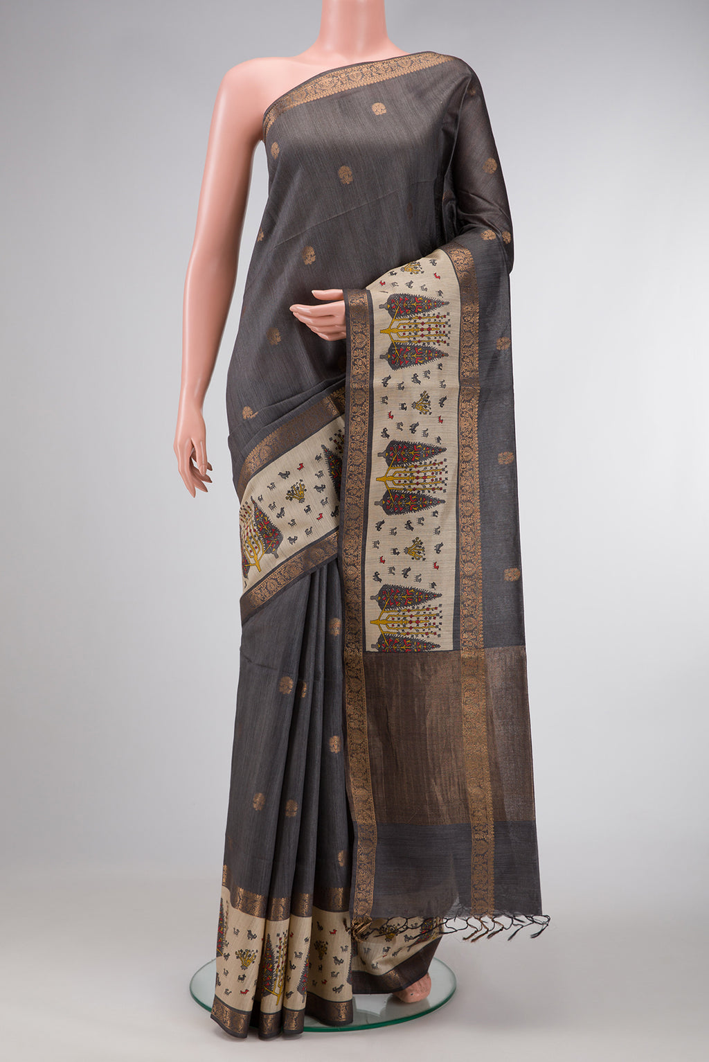 Grey Dual Tone Tussar Silk Saree with Zari Butta on the body and Fancy Border.  displayed on a mannequin