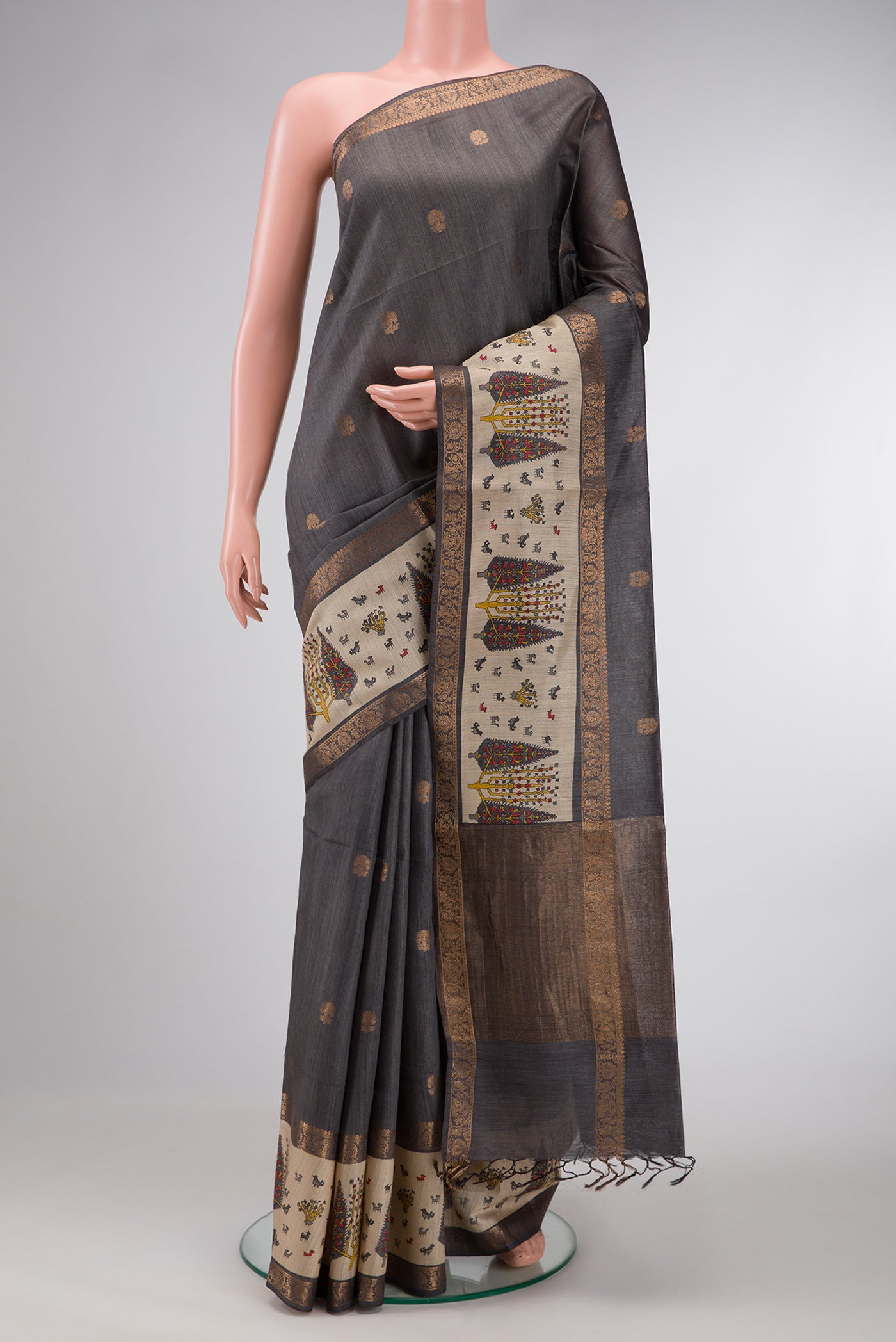 Grey Dual Tone Tussar Silk Saree with Zari Butta on the body and Fancy Border.  displayed on a mannequin