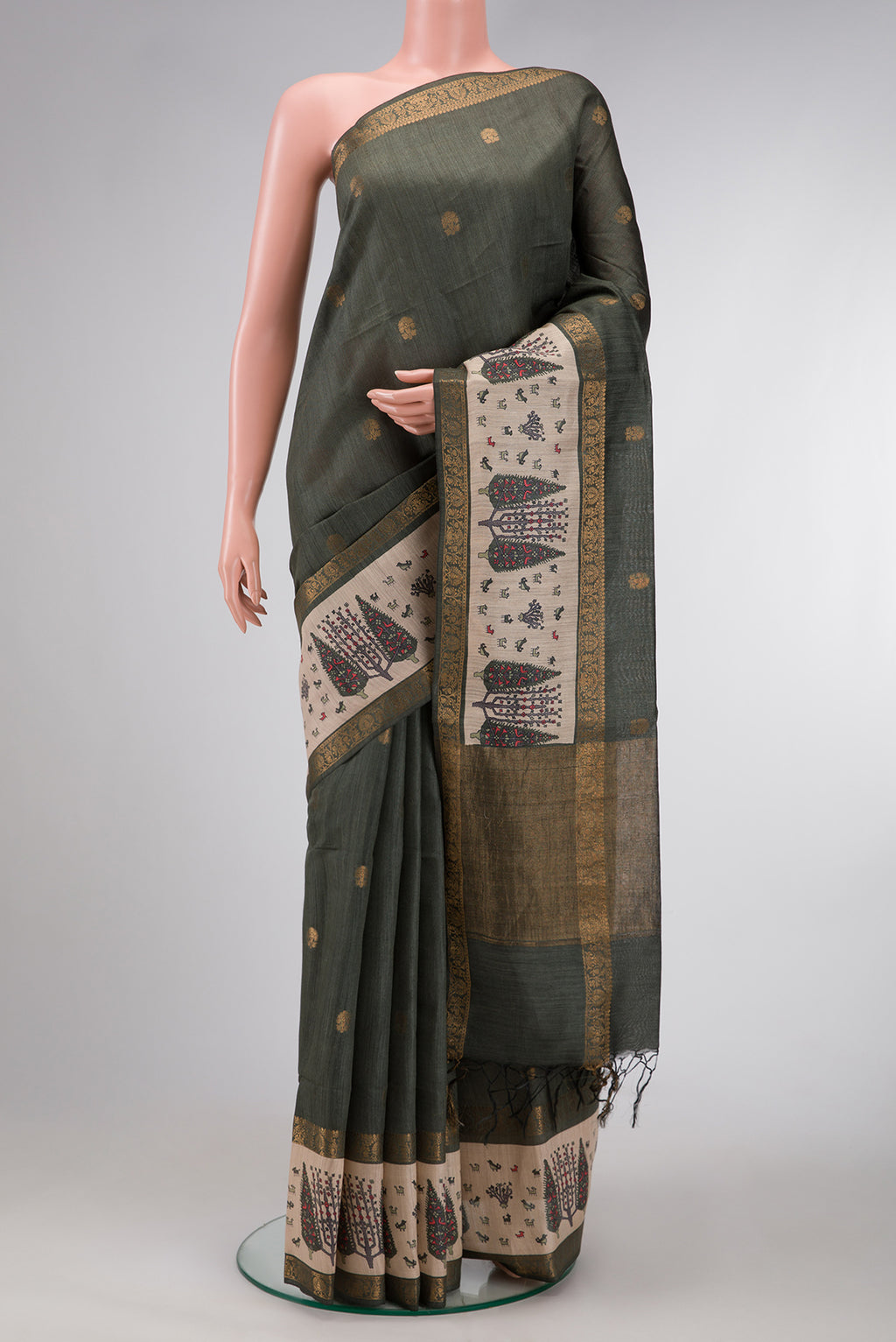 Green Dual Tone Tussar Silk Saree with Zari Butta on the body and Fancy Border.  displayed on a mannequin