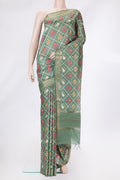 Green Dual Tone Tussar Silk Saree with Printed design on the body and Zari Border.  displayed on a mannequin