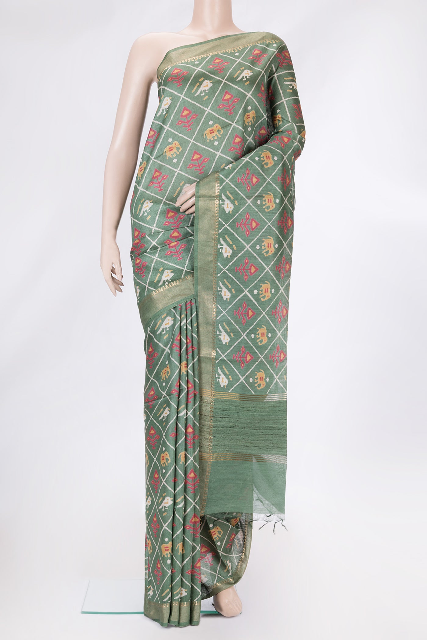 Green Dual Tone Tussar Silk Saree with Printed design on the body and Zari Border.  displayed on a mannequin
