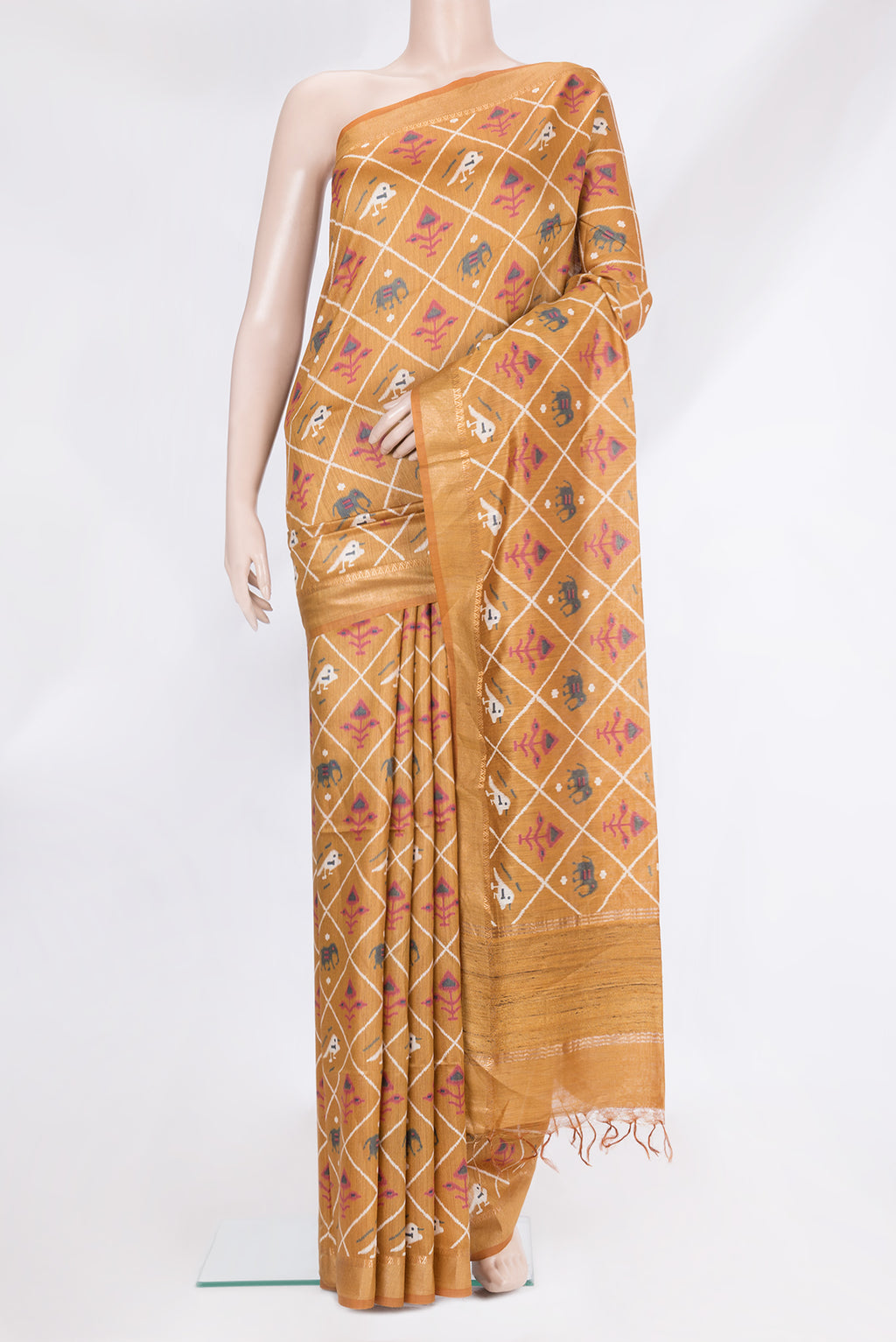 Gold Tussar Silk Saree with Ikat Print on the body and Zari Border.  displayed on a mannequin