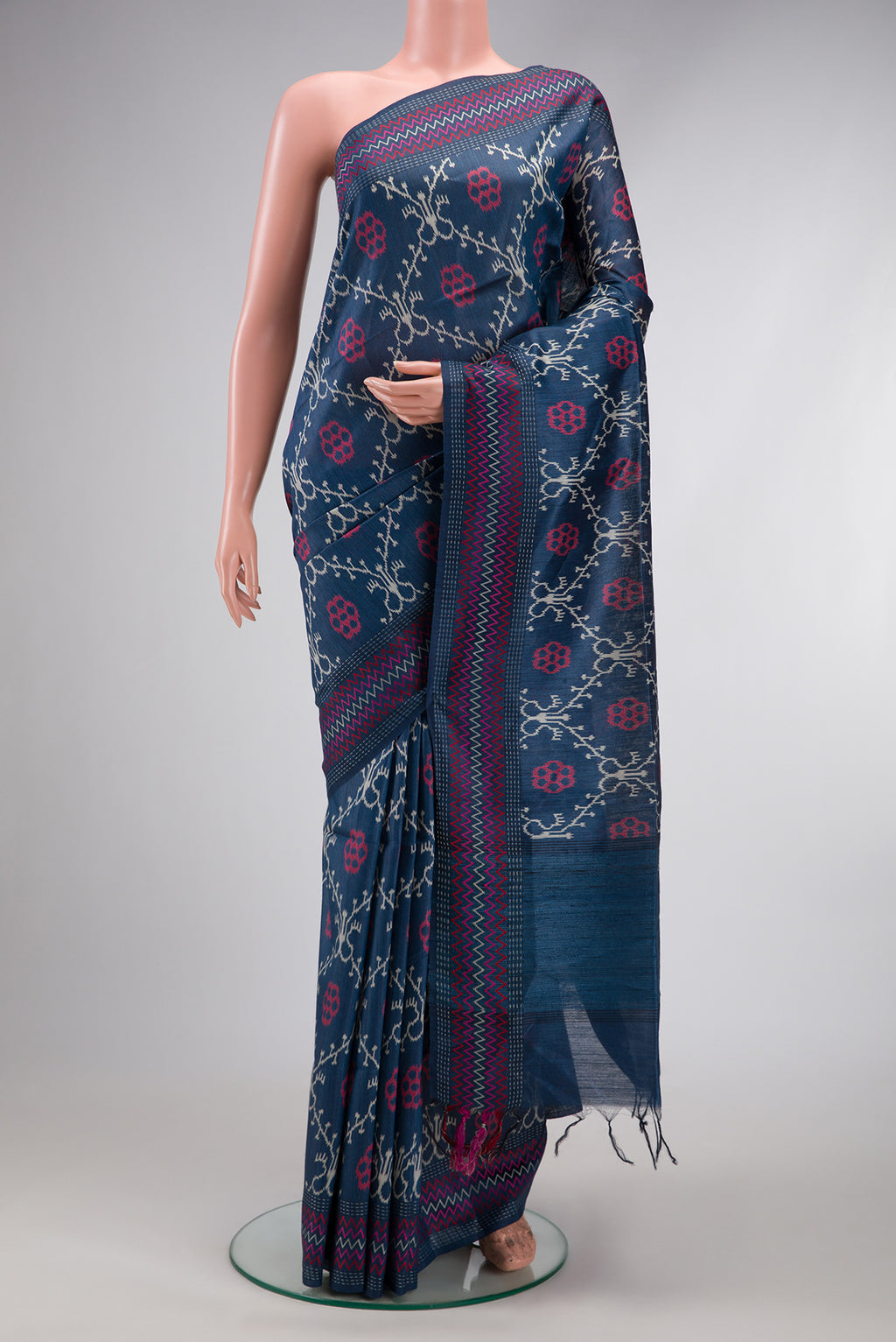 Navy Blue Dual Tone Tussar Silk Saree with Printed design on the body and Embroidery Border.  displayed on a mannequin