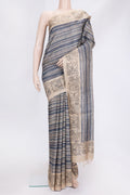 Beige Dual Tone Tussar Silk Saree with Printed design on the body and Printed Border.  displayed on a mannequin