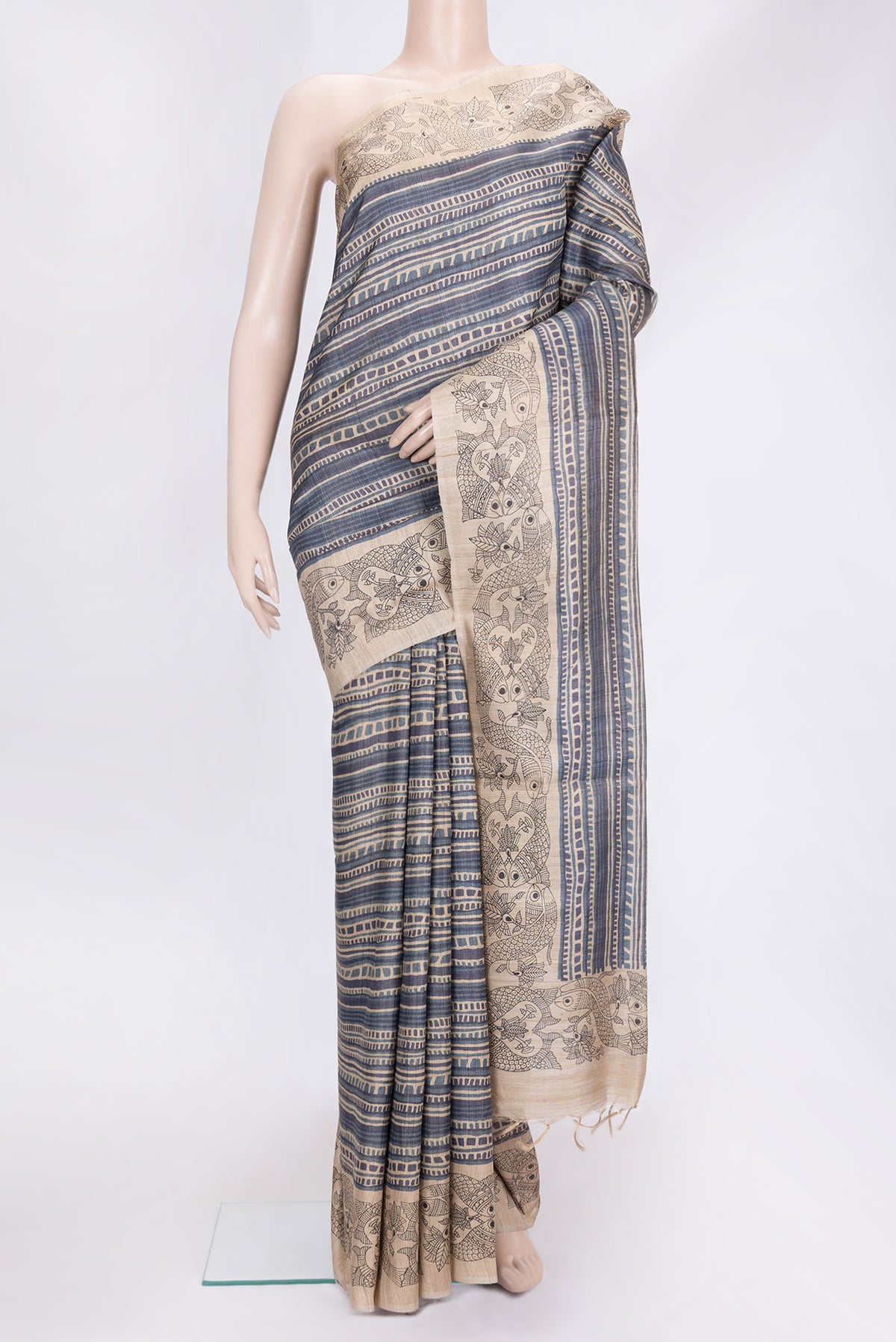 Beige Dual Tone Tussar Silk Saree with Printed design on the body and Printed Border.  displayed on a mannequin