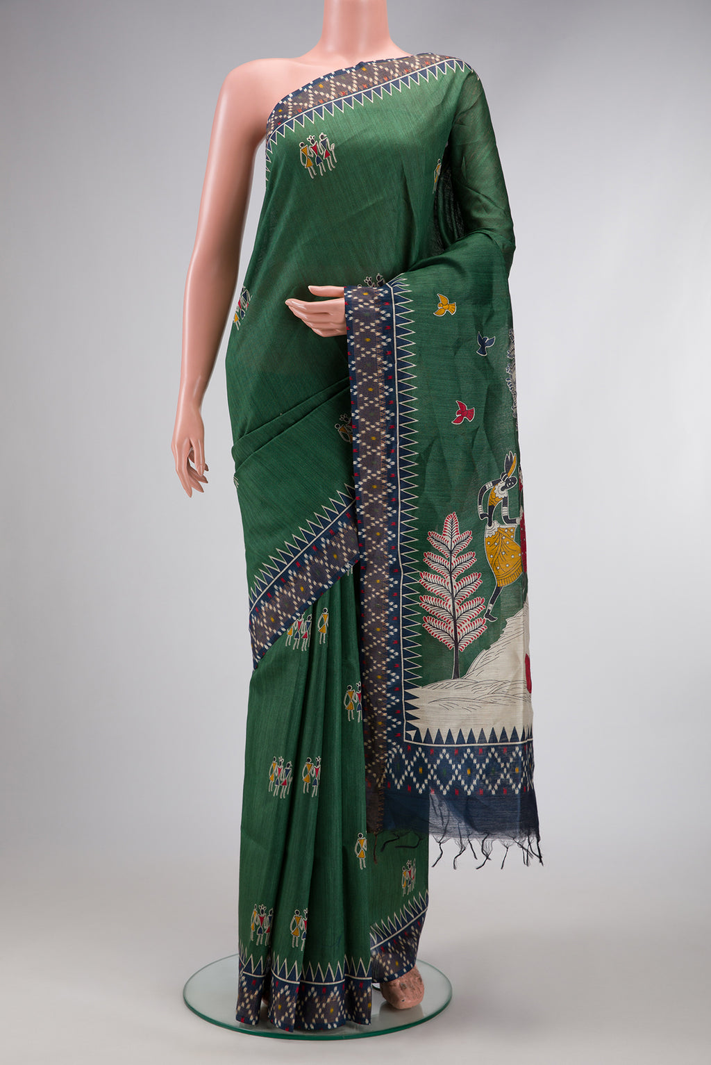 Green Dual Tone Tussar Silk Saree with Printed design on the body and Ikat Border.  displayed on a mannequin
