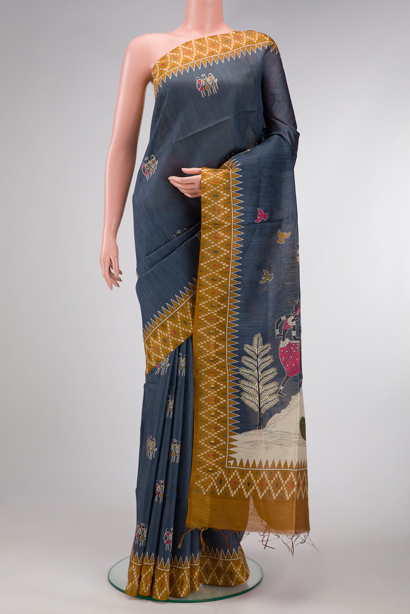 Grey Dual Tone Tussar Silk Saree with Printed design on the body and Ikat Border.  displayed on a mannequin