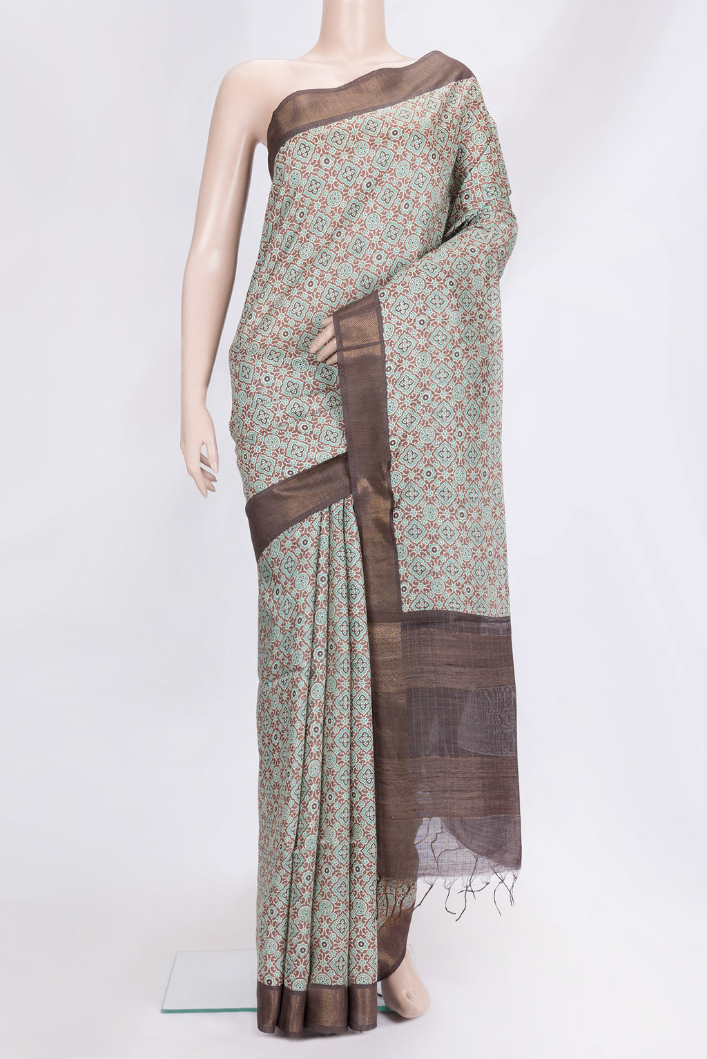 Brown Dual Tone Tussar Silk Saree with Printed design on the body and Zari Border.  displayed on a mannequin