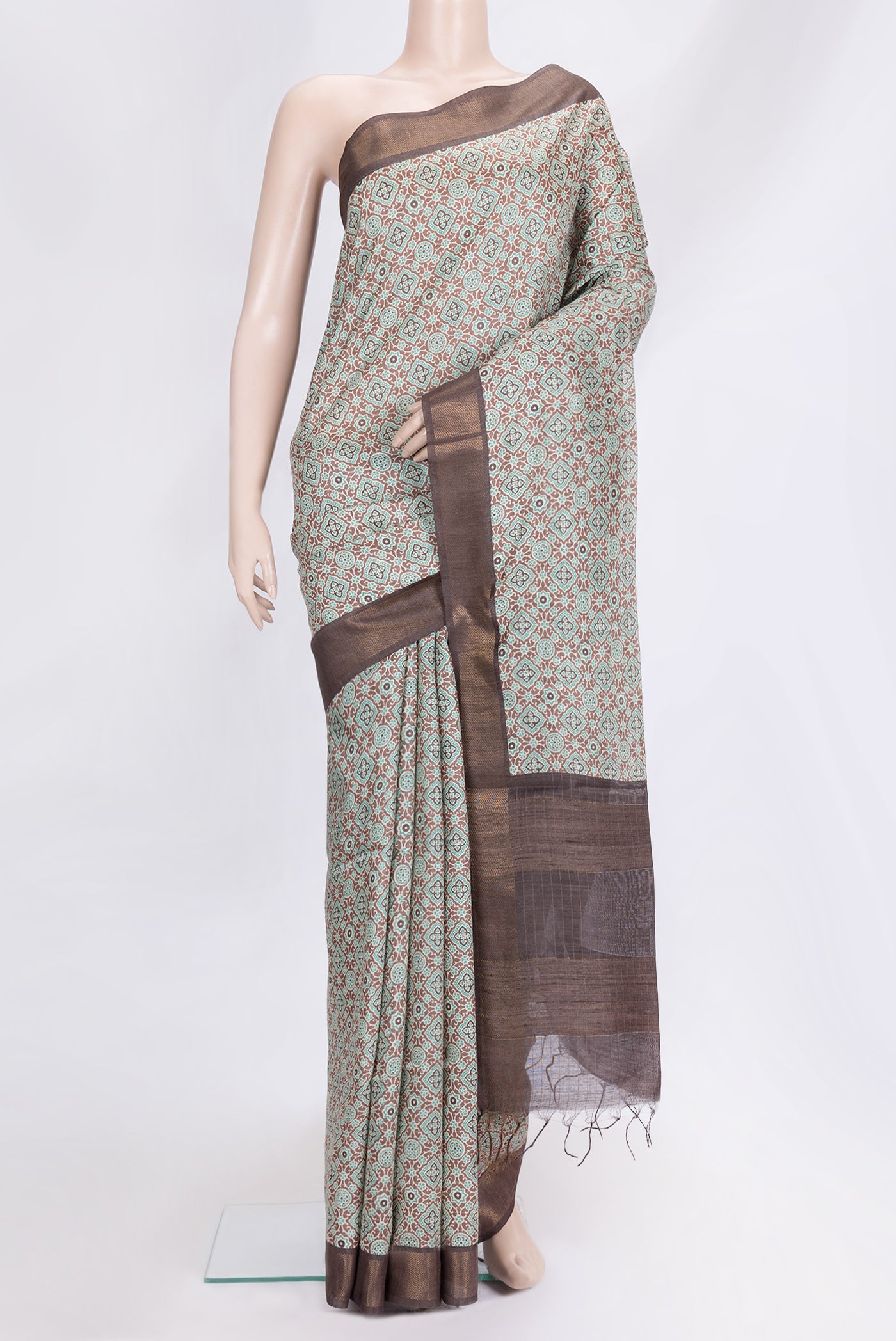 Brown Dual Tone Tussar Silk Saree with Printed design on the body and Zari Border.  displayed on a mannequin